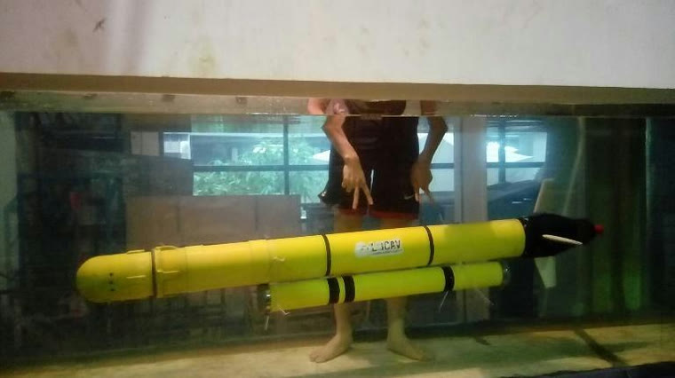 The vehicle submerged in a glass-walled test pool during trials